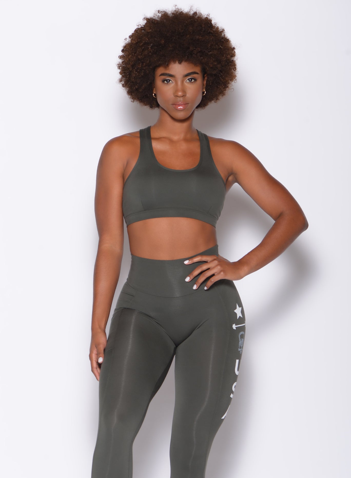 front view of model in a two piece activewear set with side printing down one leg