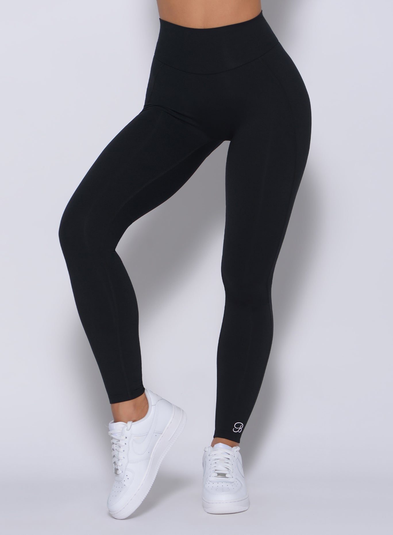 Zoomed in front view of our black uplift leggings
