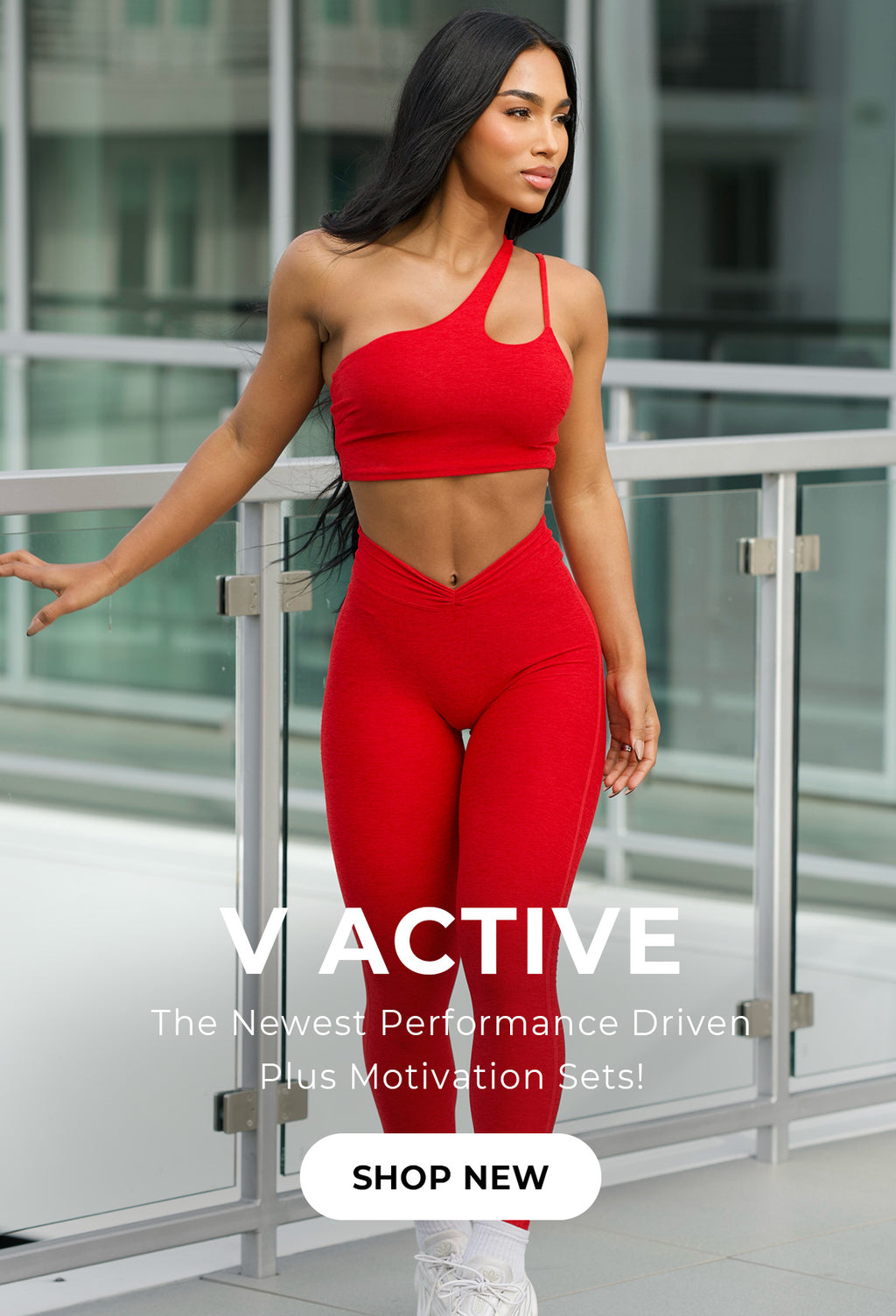 Model posing wearing Lateral Top and V Active Leggings in Scarlet Red