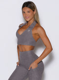 front left side view of a model wearing the Ace Active Top in Champion Gray color