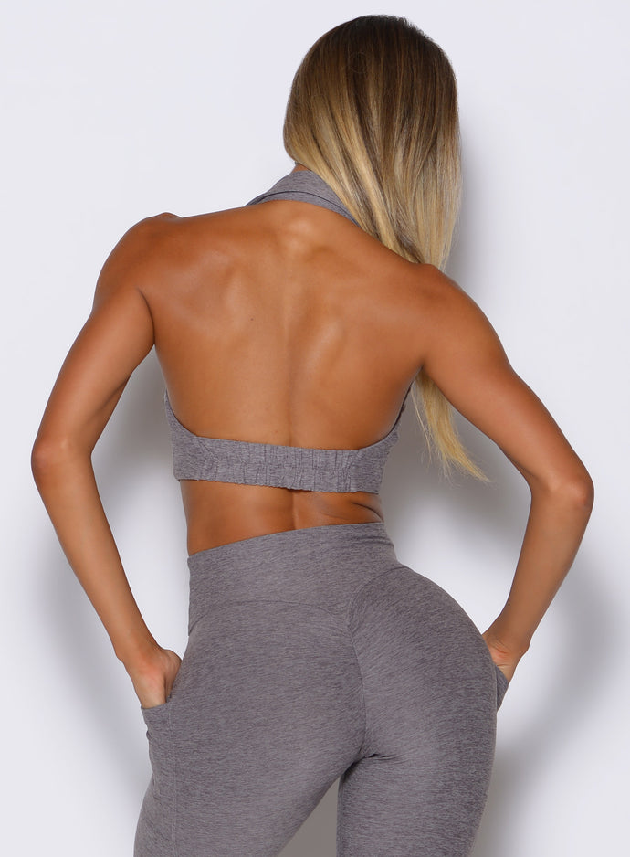 back profile view of a model wearing the Ace Active Top in Champion Gray color