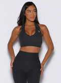 front view of a model looking to the left side wearing the Ace Active Top in Charcoal color