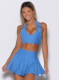 model captured from the front wearing the Ace Active Top in Legacy Blue color