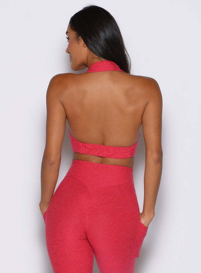 back profile view of a model wearing the Ace Active Top in Victory Ruby color