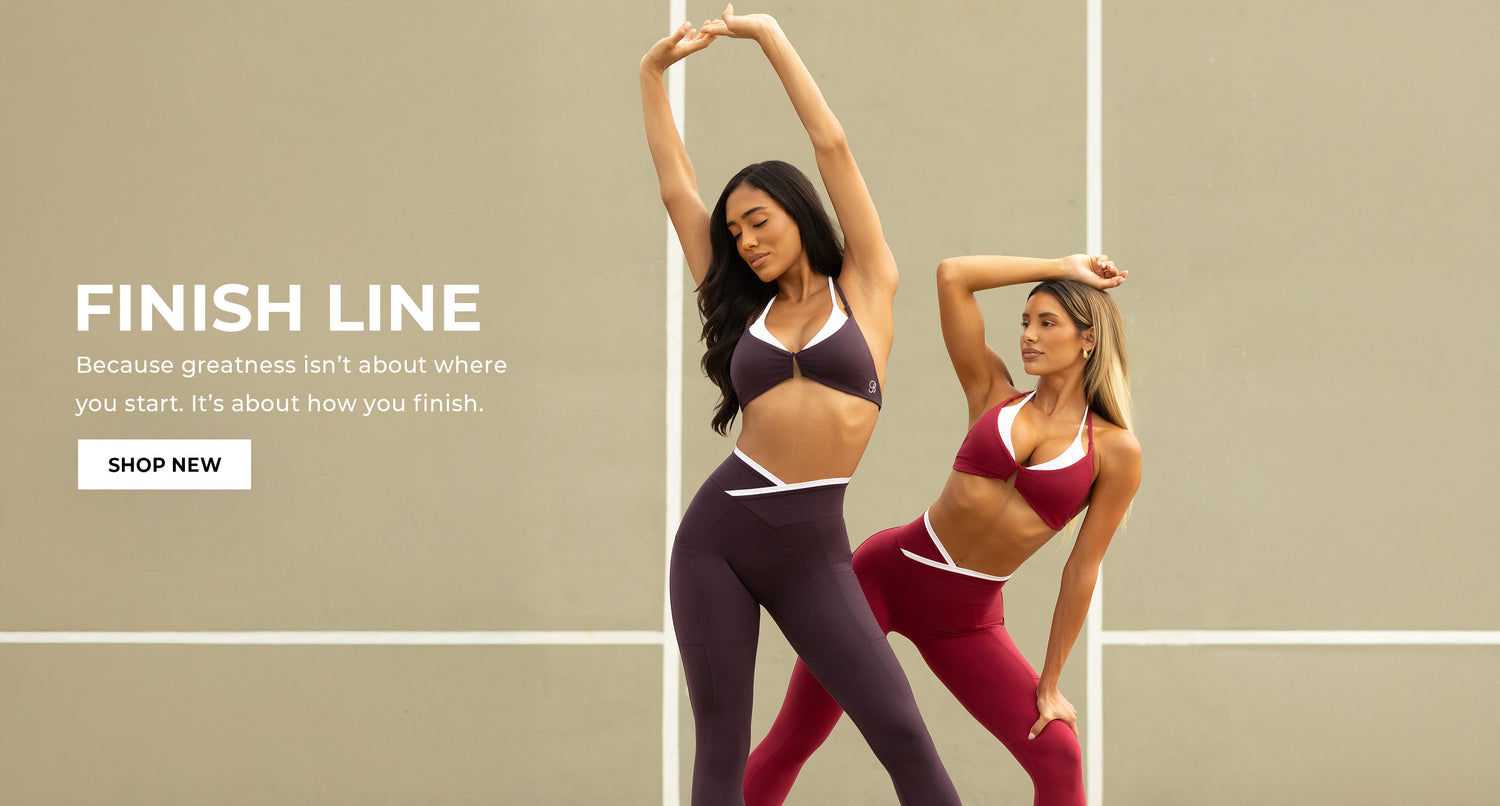 Two women in athletic wear set stretching against a beige background with 'Finish Line' text overlay 'Because greatness isn't about where you start. It's about how you finish.' CTA 'SHOP NOW'