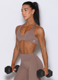 Cocoa Ace Bra with rounded notch neckline and sculpting support during dumbbell strength training
