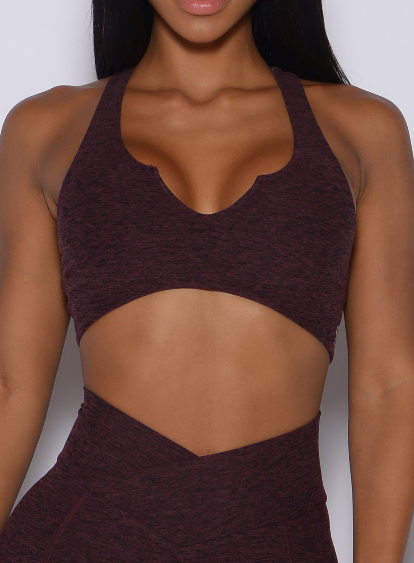 Zoomed in front view of our ace sports bra in port color 