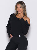 front profile view of a model wearing the Allure Pullover in Black color