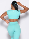 back profile view of a model wearing the B Scrunchie in Aquatic Awe color
