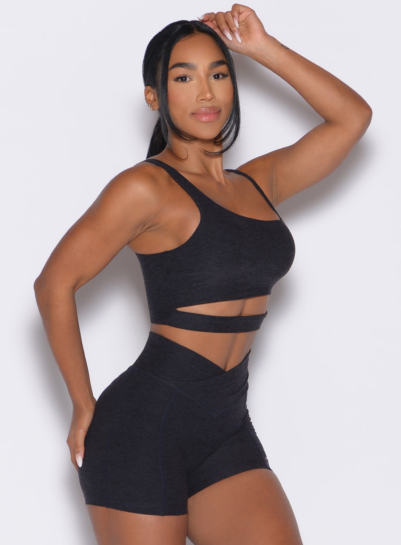 Heathered Black Asymmetrical Slit Bra with front cutout; sculpted support for gym performance.