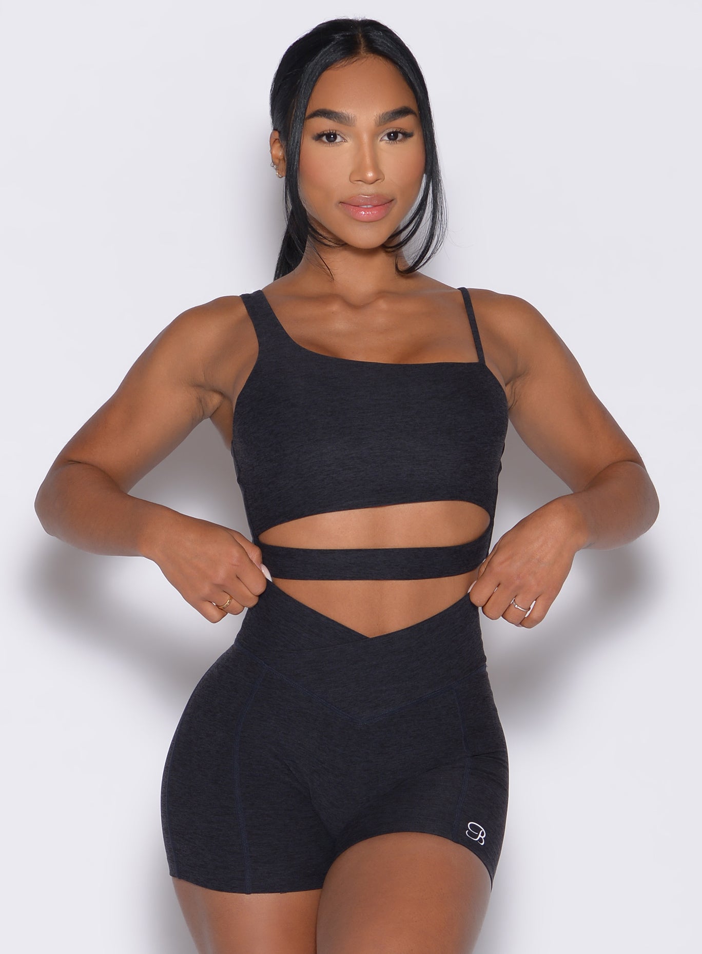 Heathered Black Asymmetrical Slit Bra with front cutout and Tiny Waist Shorts for a sculpted fit.