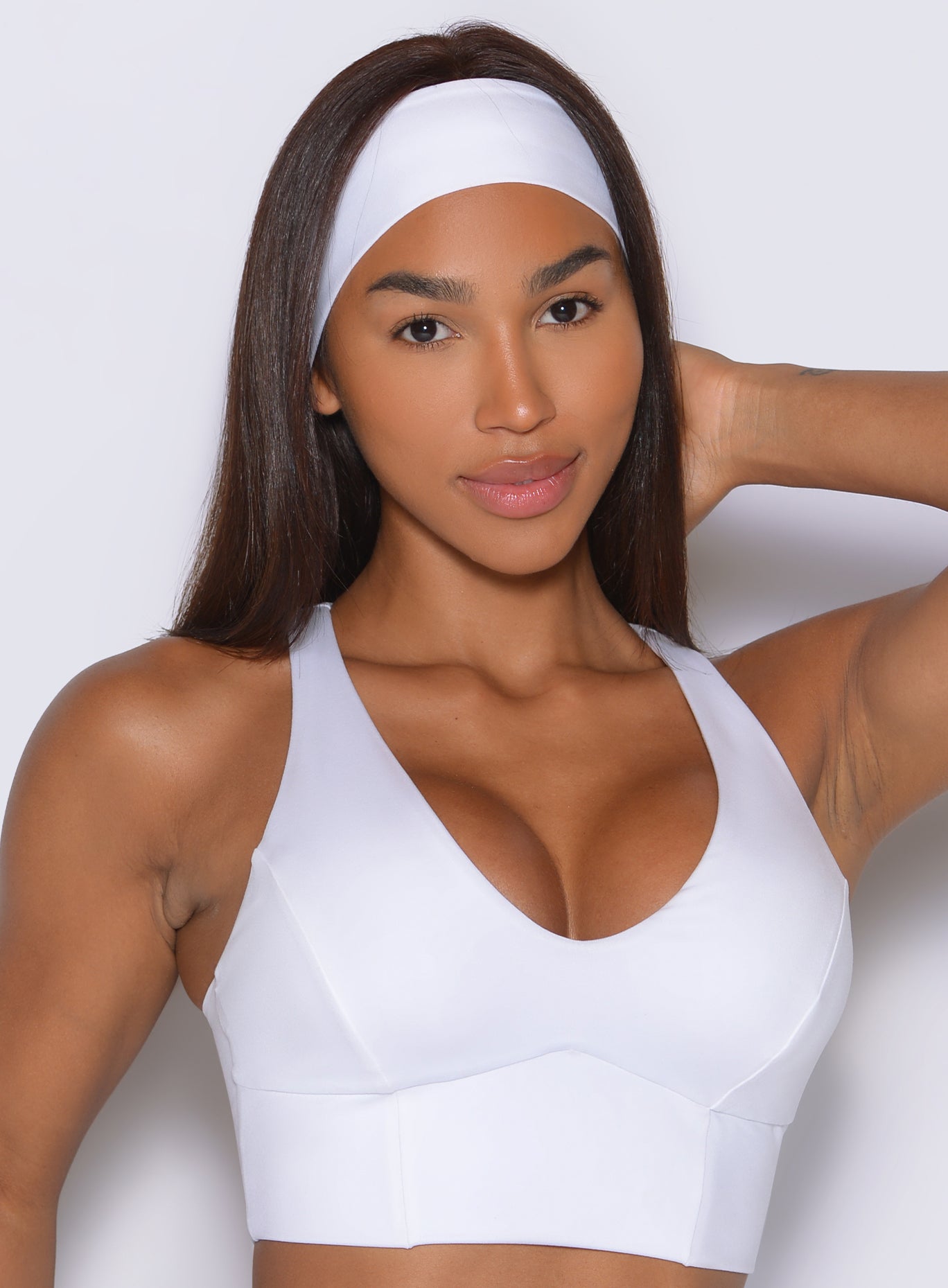 Full front view of White B Fit Headband featuring a clean performance fit that keeps hair comfortably secure.