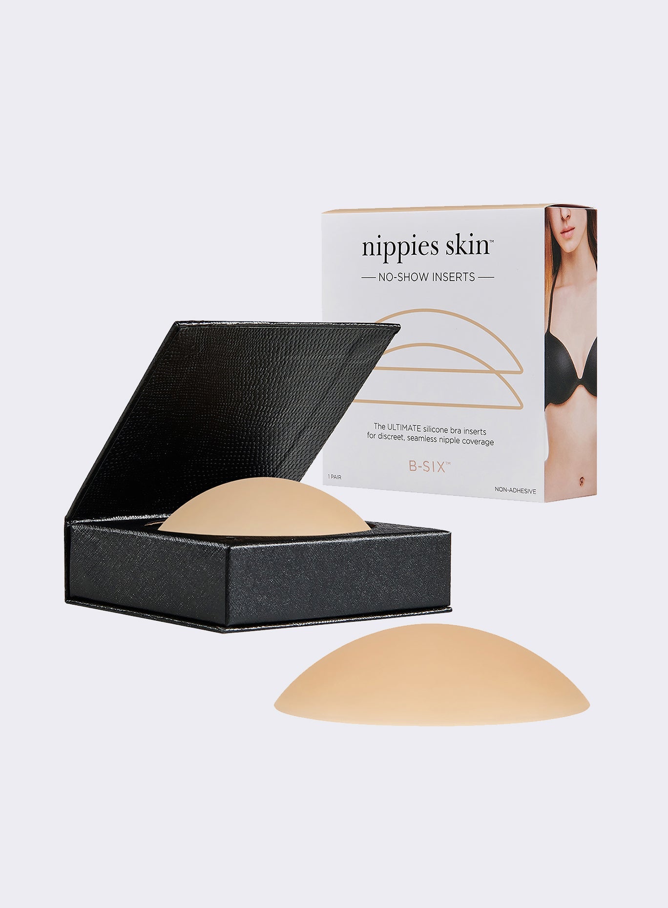 Creme Nippies matte silicone covers beside a sleek, gray magnetic travel case for storage.