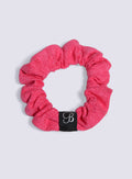B Scrunchie in neon flame color viewed from the top