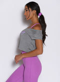 left side view of a model wearing the B Scrunchie in purple rain color