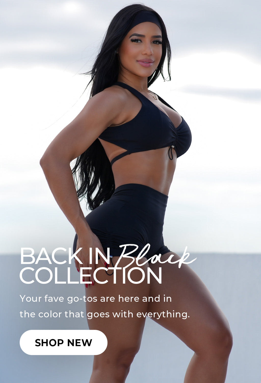 "Back in Black Collection" banner featuring a woman in a black workout set with cut-out detailing, standing confidently against a bright sky backdrop. Bold text: "BACK IN Black COLLECTION"; subtext reads: "Your fave go-tos are here and in the color that goes with everything." CTA button reads: "SHOP NEW."