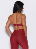 Back side close up view of model wearing the Backless Bra in Garnet Red color