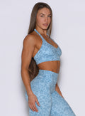 Right side profile view of the model wearing our Backless Bra in Leopard Glacial Blue.