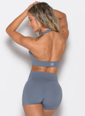 back profile view of a model wearing the Backless Knot Bra in Basalt color