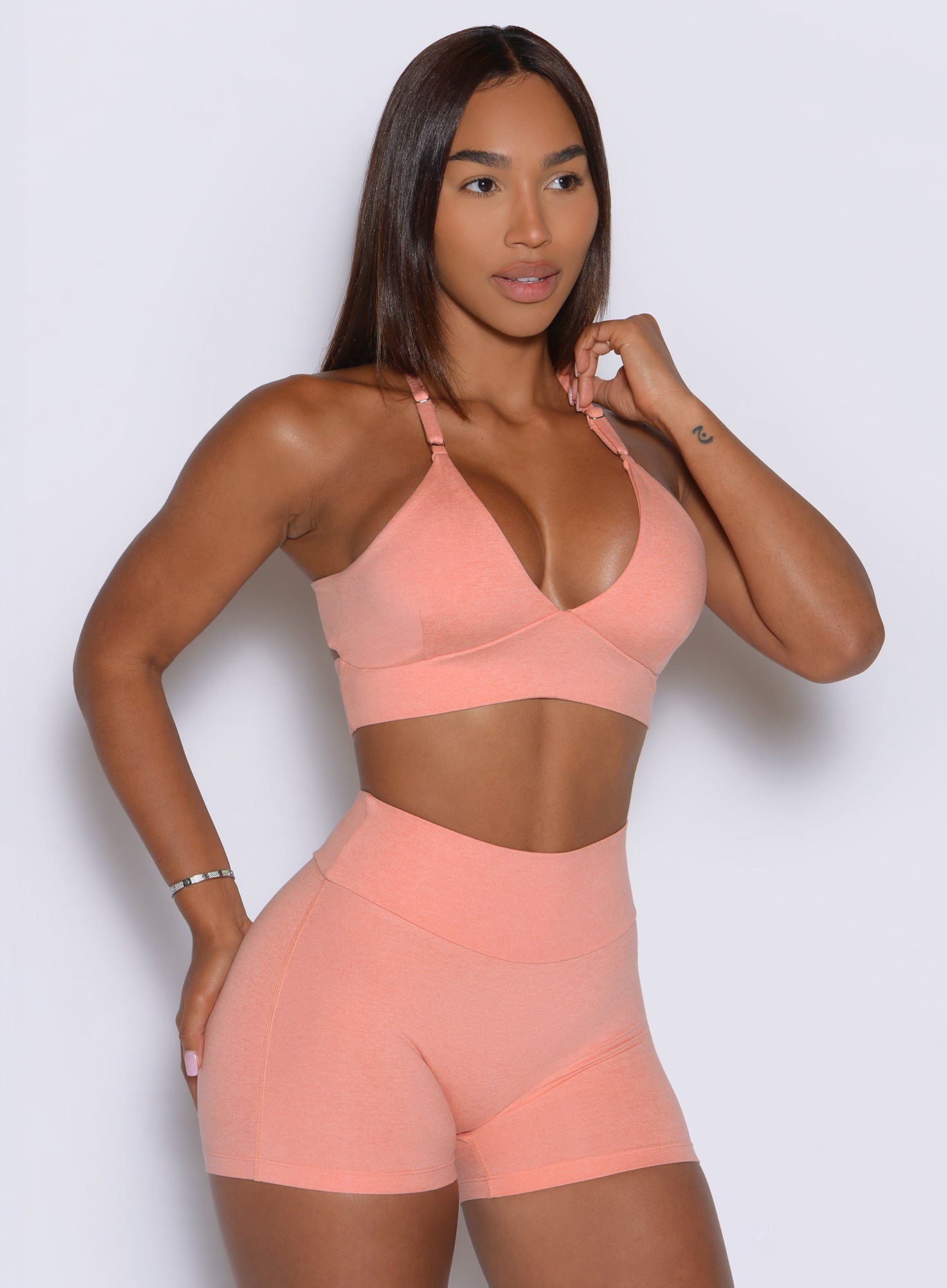 Buttery-soft fabric gives this Coral Peach bra a sleek finish with flexible workout comfort