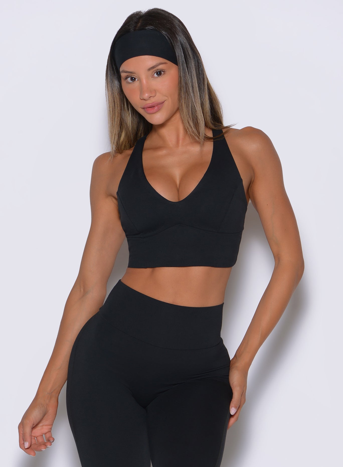 Reinforced chest banding on the black Body Sculpt Bra, securing a confident, distraction-free hold