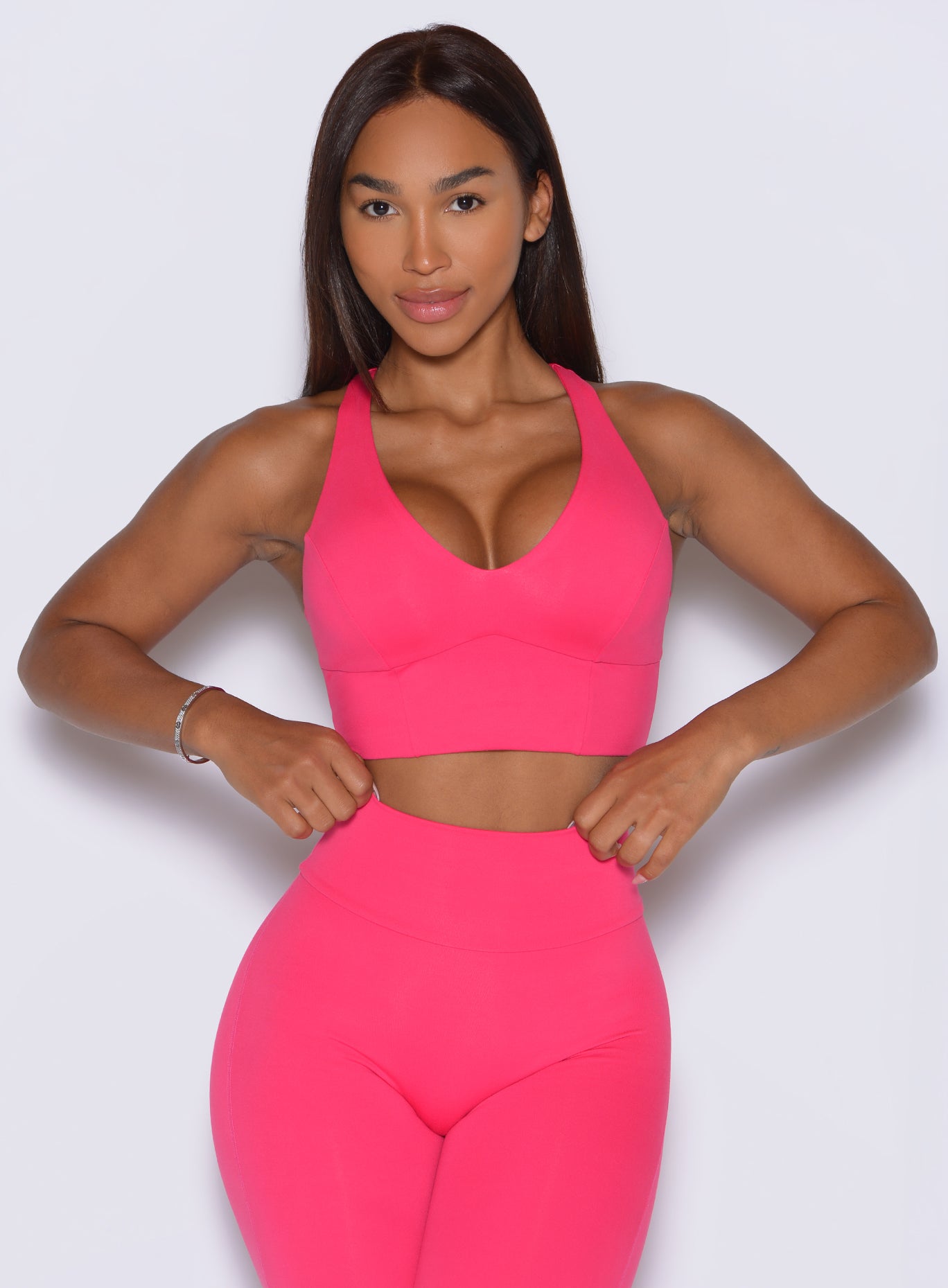 Contouring scoop seams accentuating the victory ruby Body Sculpt Bra for a flattering gym fit