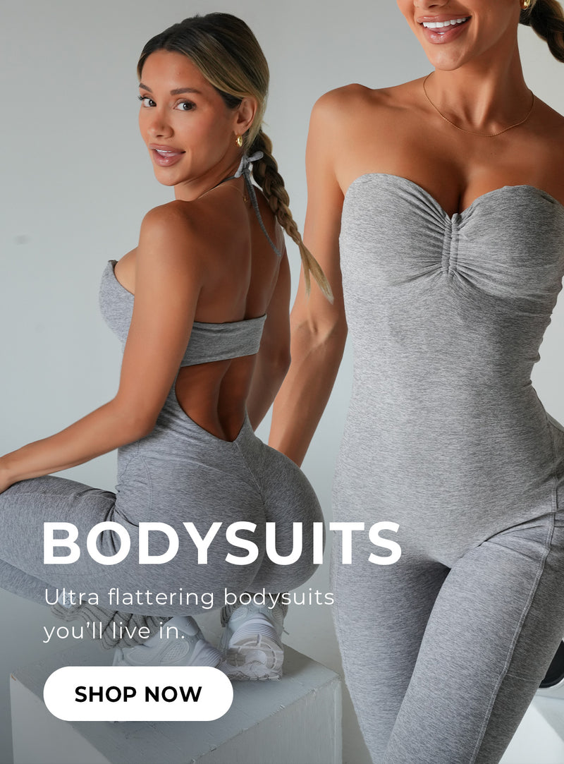 Model squatting on the left in a gray bodysuit. Model on the right is standing in a gray bodysuit. Text reads : Bodysuits, extra flattering bodysuits you'll live in. SHOP NOW.