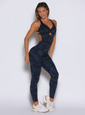 front right side profile view of a model wearing the Bombshell Bodysuit in Blue/Black camo color