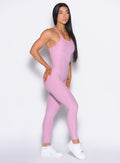 right side profile view of our model wearing the Bombshell Bunny Bodysuit 2.0 in Fondant color