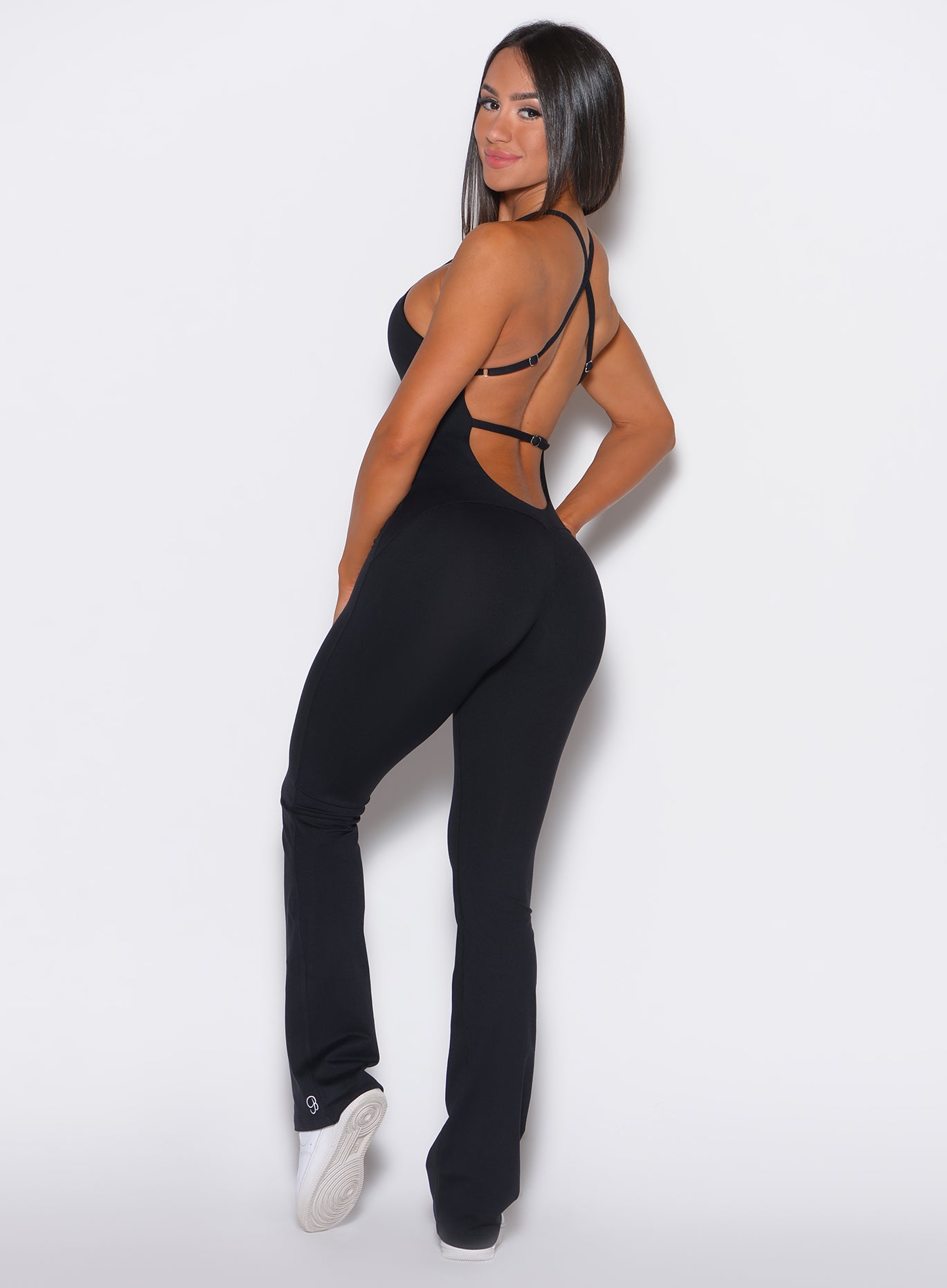 left side profile view of a model wearing our black bombshell bunny bodysuit 