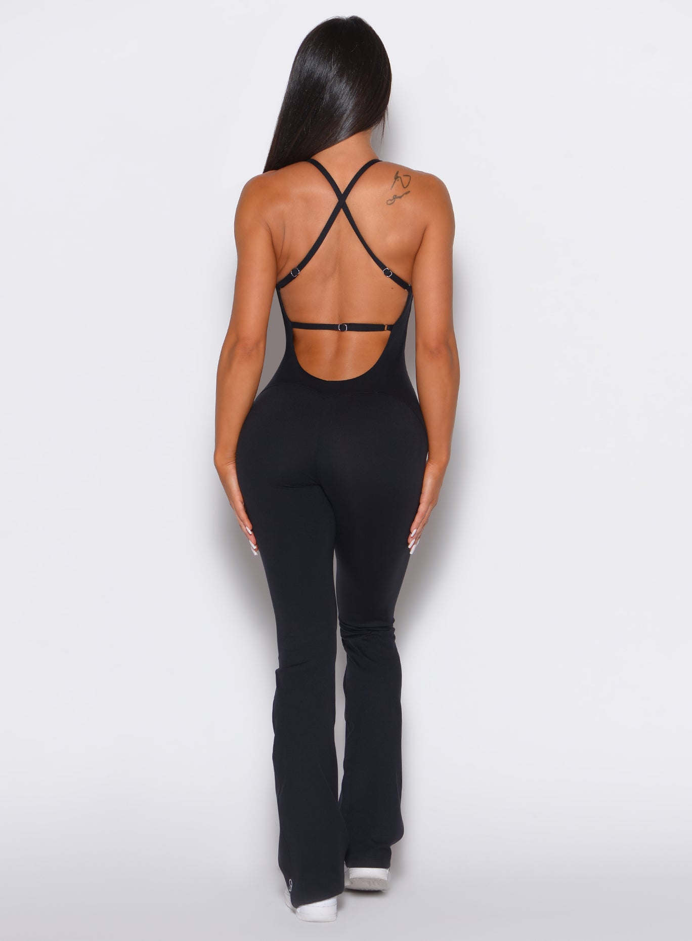 back profile view of a model wearing our black bombshell bunny bodysuit