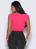 back profile view of a model facing to the left side wearing the Bombshell Era Tee in solid victory ruby color 