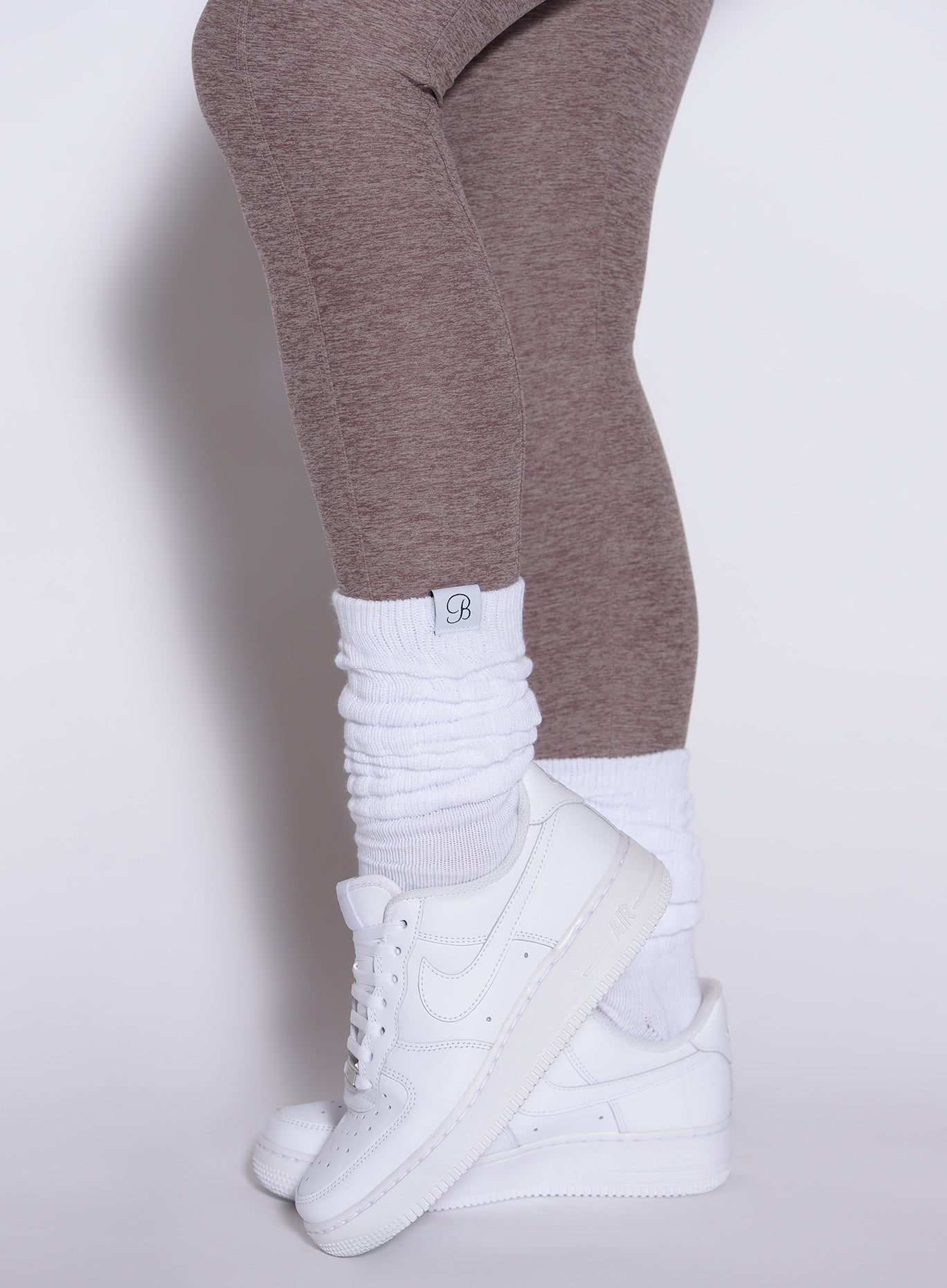 Retro-style white Slouch Socks with a thick ribbed texture for a cozy, gym-ready lifestyle look.