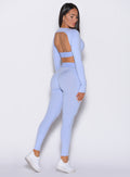 back right side profile view of our model wearing the Bombshell Active Leggings in Baby Lavender color paired with the matching pullover 