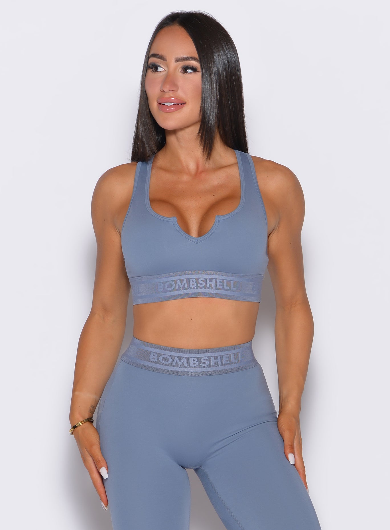 Flinstone Bombshell Active Bra with V-cut front and logo elastic band for high-performance support.
