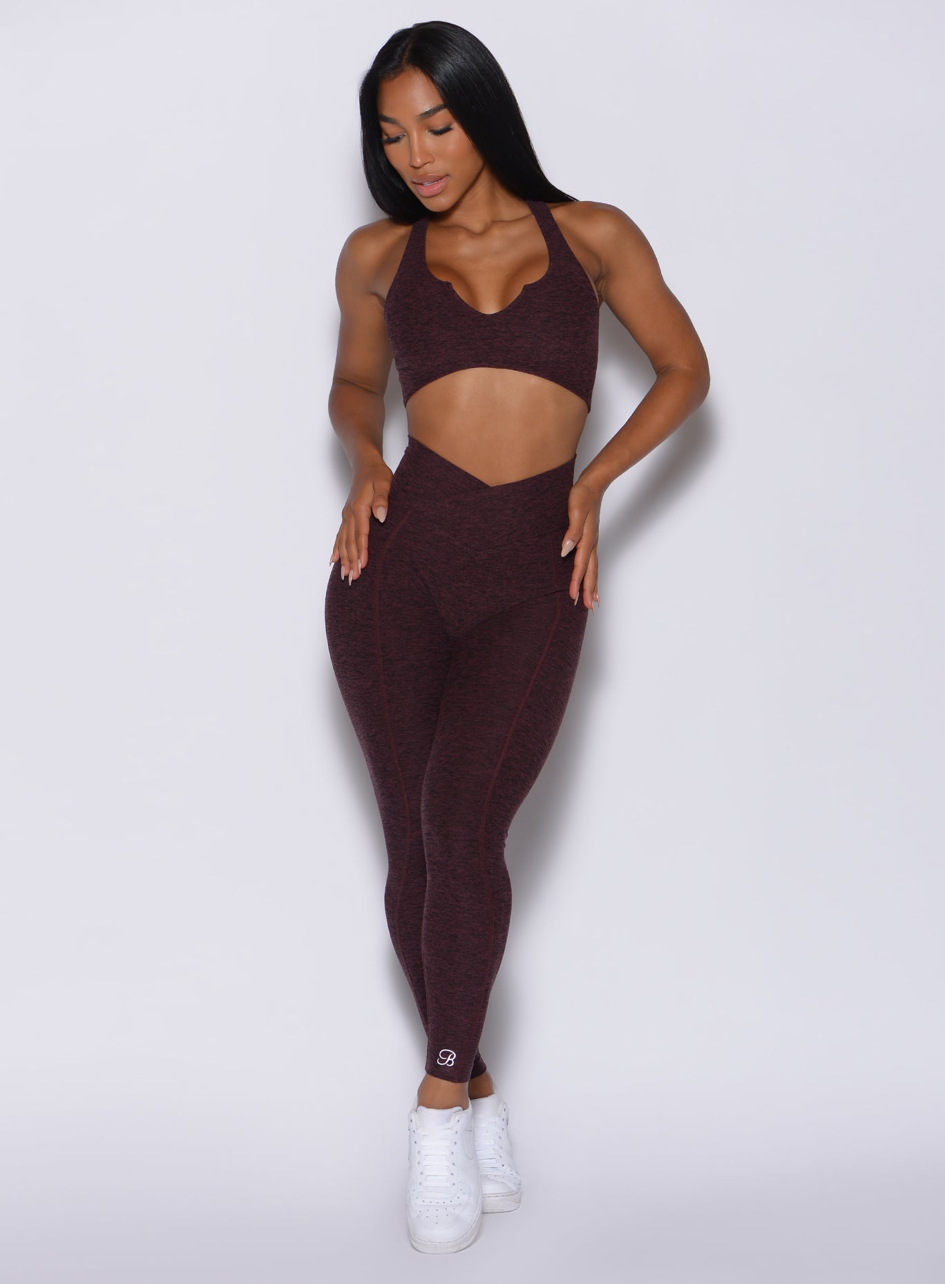 front profile view of a model in our Brazilian Contour Leggings in port color and a matching bombshell bra
