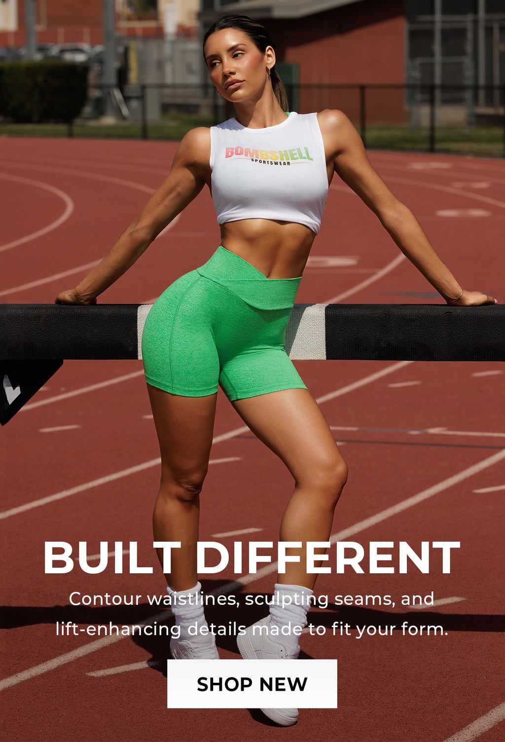 Woman in green athletic wear shorts and a white tank top that says BOMBSHELL SPORTSWEAR on a track with promotional text overlay that says BUILT DIFFERENT. Contour Waistlines, sculpting seams, and lift-enhancing details, made to fit your form. SHOP NEW