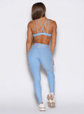 back profile view of a model wearing the Built Leggings in Blue mist color
