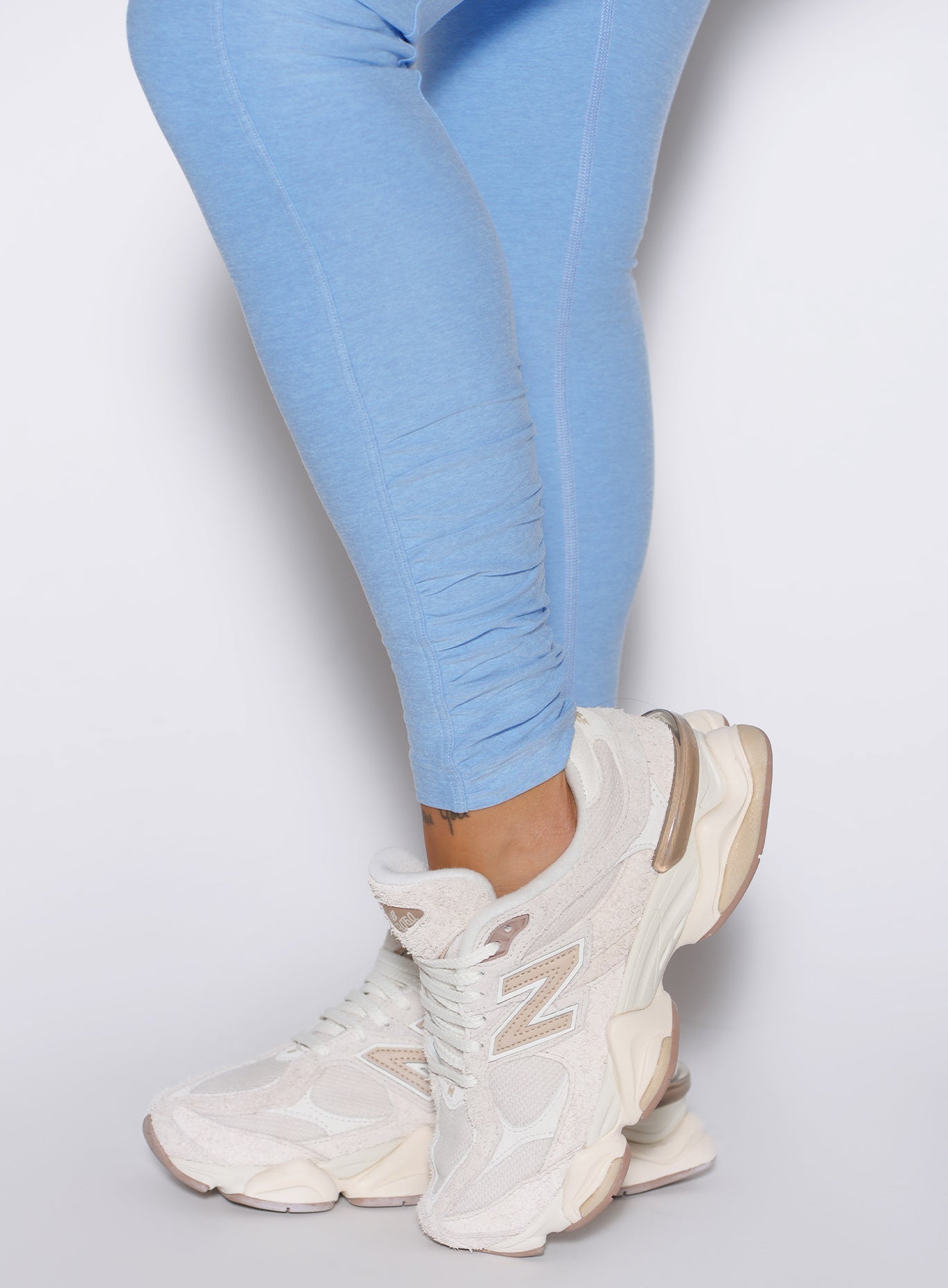 close up detailed shot of the Side ankle scrunch on the Built Leggings in Blue mist color