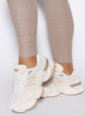 close up shot of the ankle scrunch on the Built Leggings in Desert taupe color