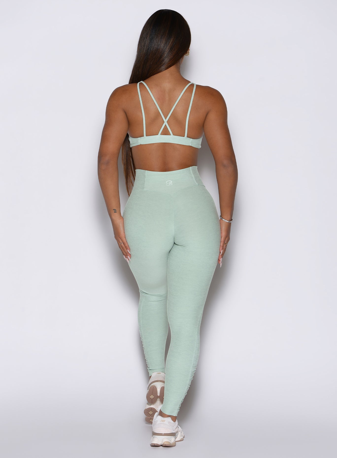 Rear view of Soft Aloe Built Leggings with ankle scrunch panels and a sculpting high-waist fit.