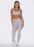 front view of a model wearing the Built Leggings in violet ice color