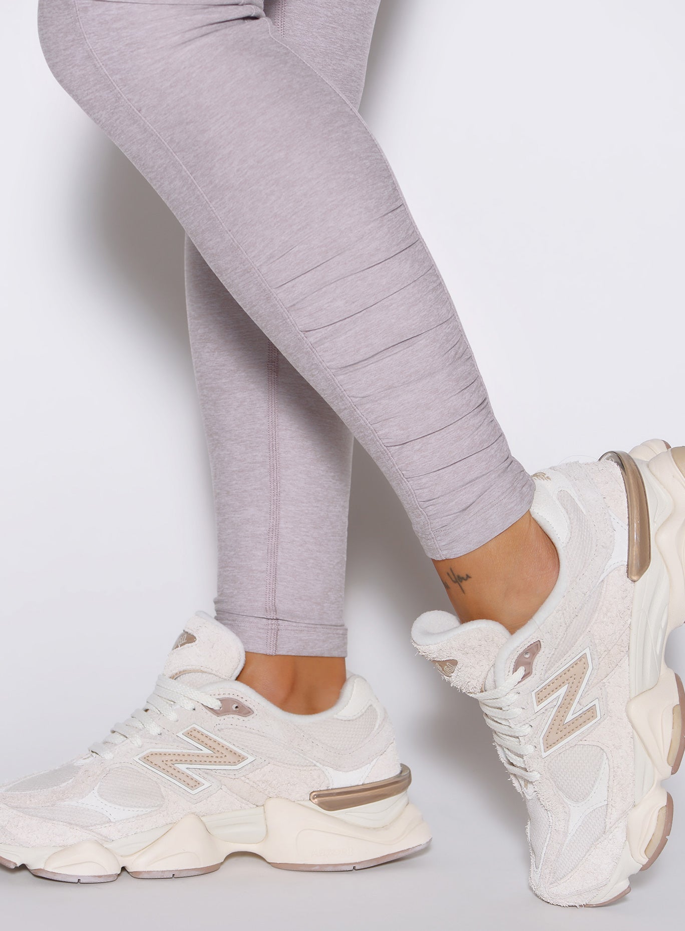 Close-up of the ankle scrunch detail on Violet Ice Built Leggings, a sculpting gym activewear piece.