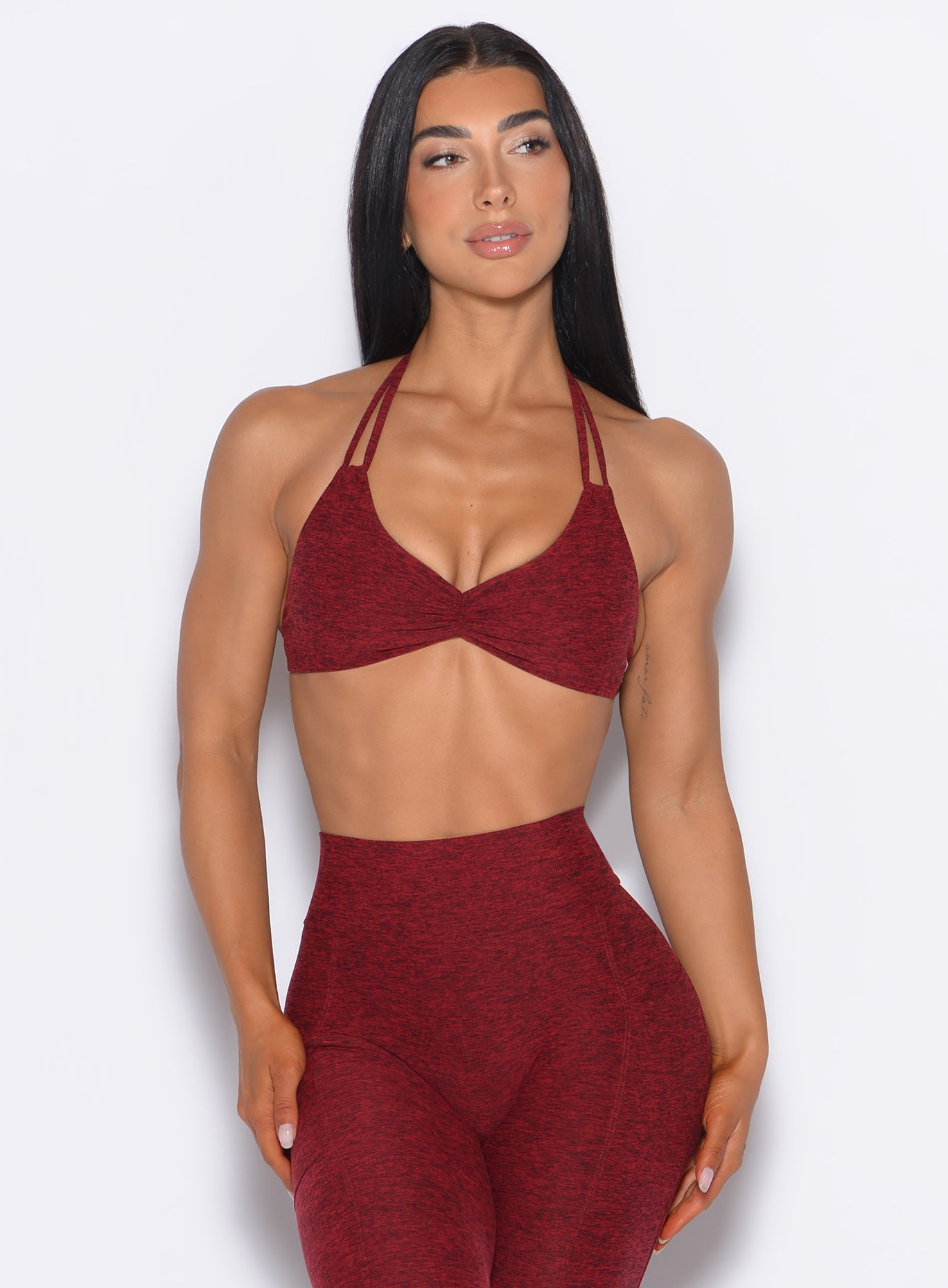 Sculpting Black Cherry Butterfly Sports Bra with a deep V-scrunch front for gym-ready confidence.