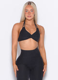 front profile view of our model looking forward wearing the Butterfly Sports Bra in Onyx color