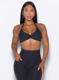 front profile view of our model wearing the Butterfly Sports Bra in Onyx color