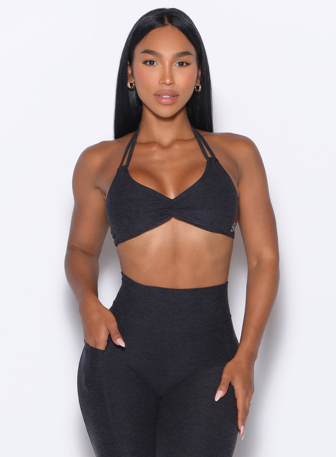 front profile view of our model wearing the Butterfly Sports Bra in Onyx color