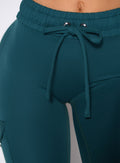 close up front profile shot of the waistband on the Cargo Edge Leggings in dark sea color