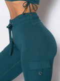 close up shot of the waistband on the Cargo Edge Leggings in dark sea color