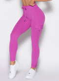 close up front left side view of a model wearing the Cargo Edge Leggings in hyper violet color